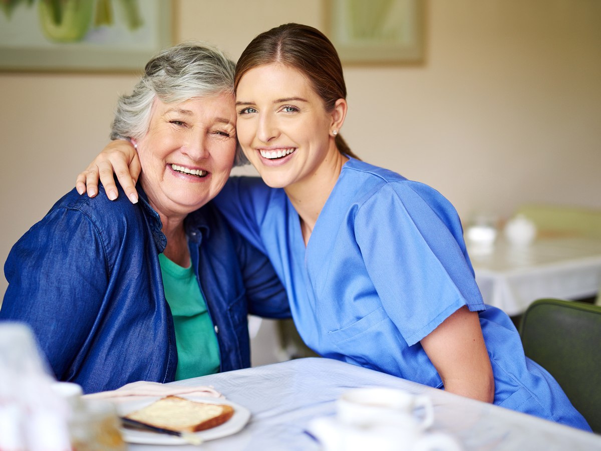 A care professional with an older adult